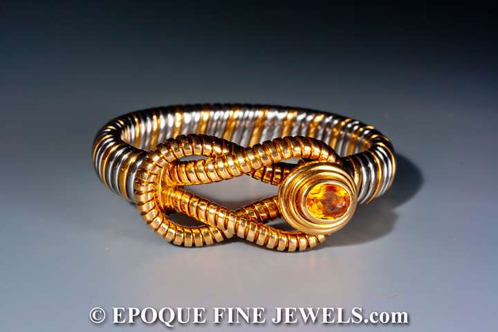 An 18 karat gold and stainless steel bracelet